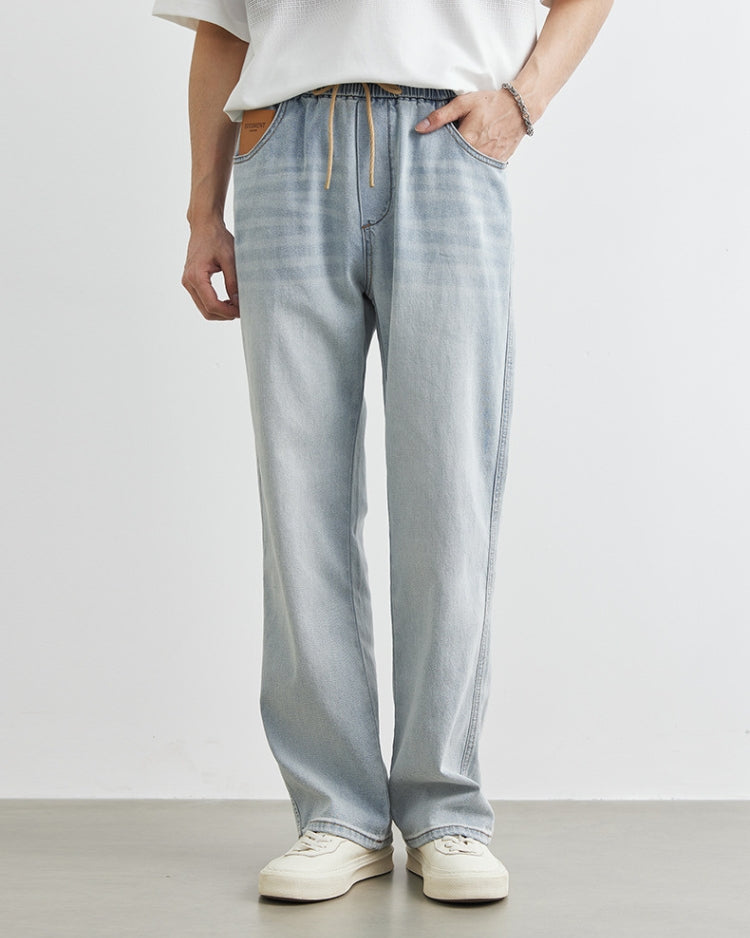 بنطلون جينز بحزام خصر مطاطي خفيف الغسيل الخفيف