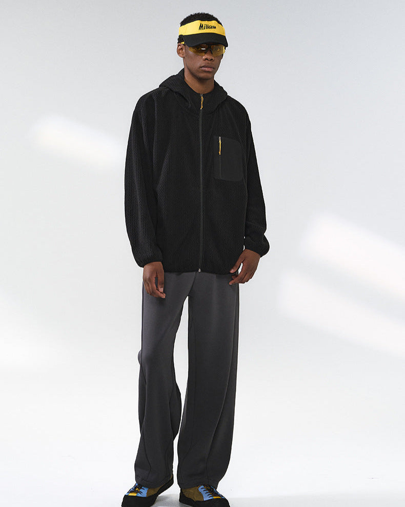 Die Jacke mit Kapuze und Waffelmuster