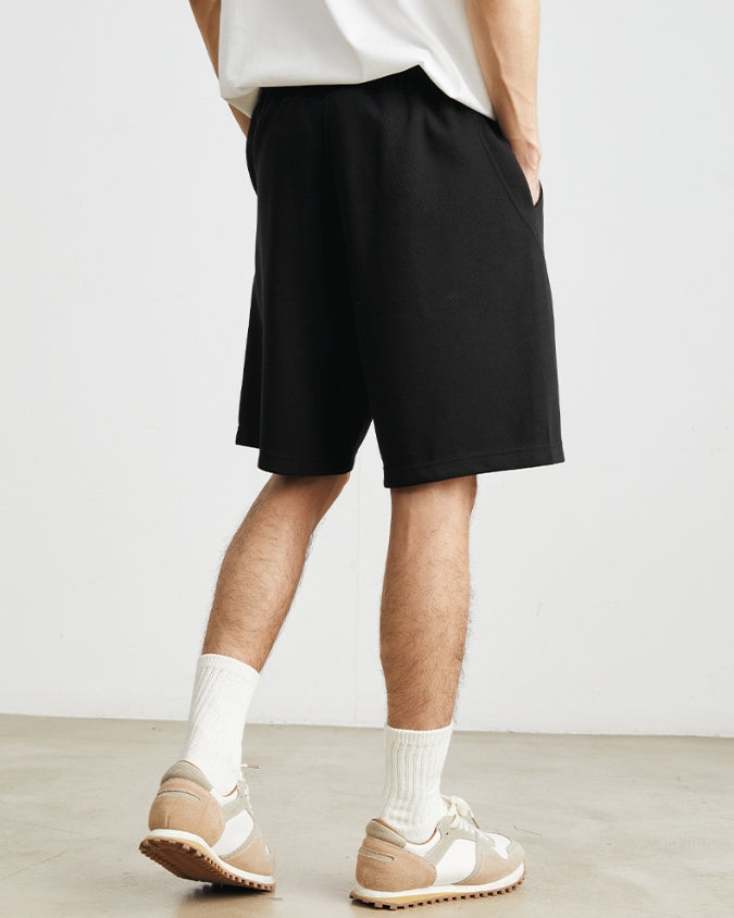 Pantalón corto ancho relajado con cordones