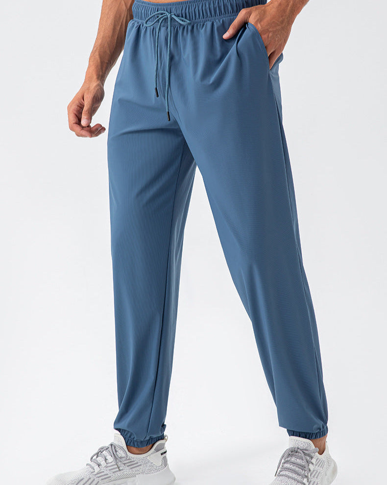Pantalones deportivos elásticos de nylon Cool Loose de secado rápido