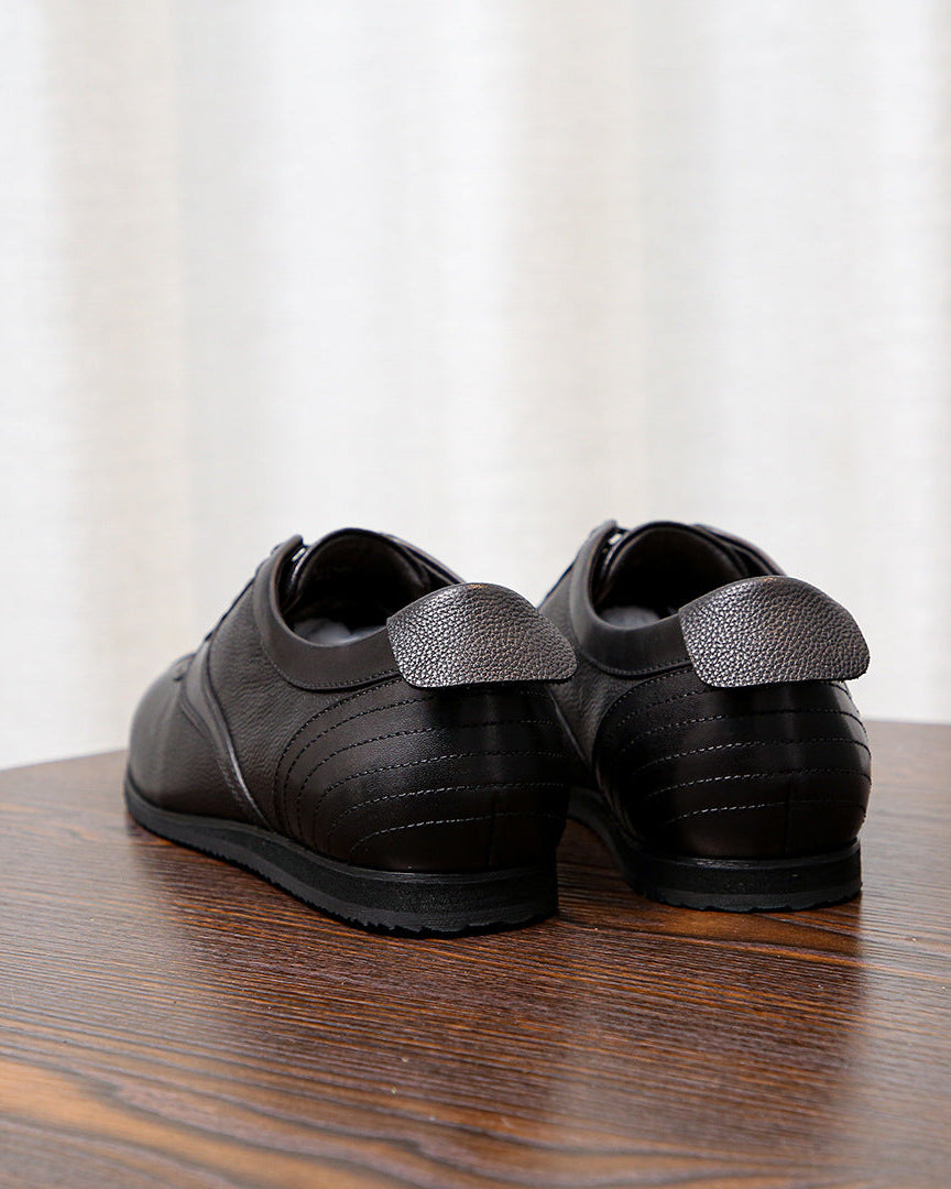 Zapatilla baja Executive de piel