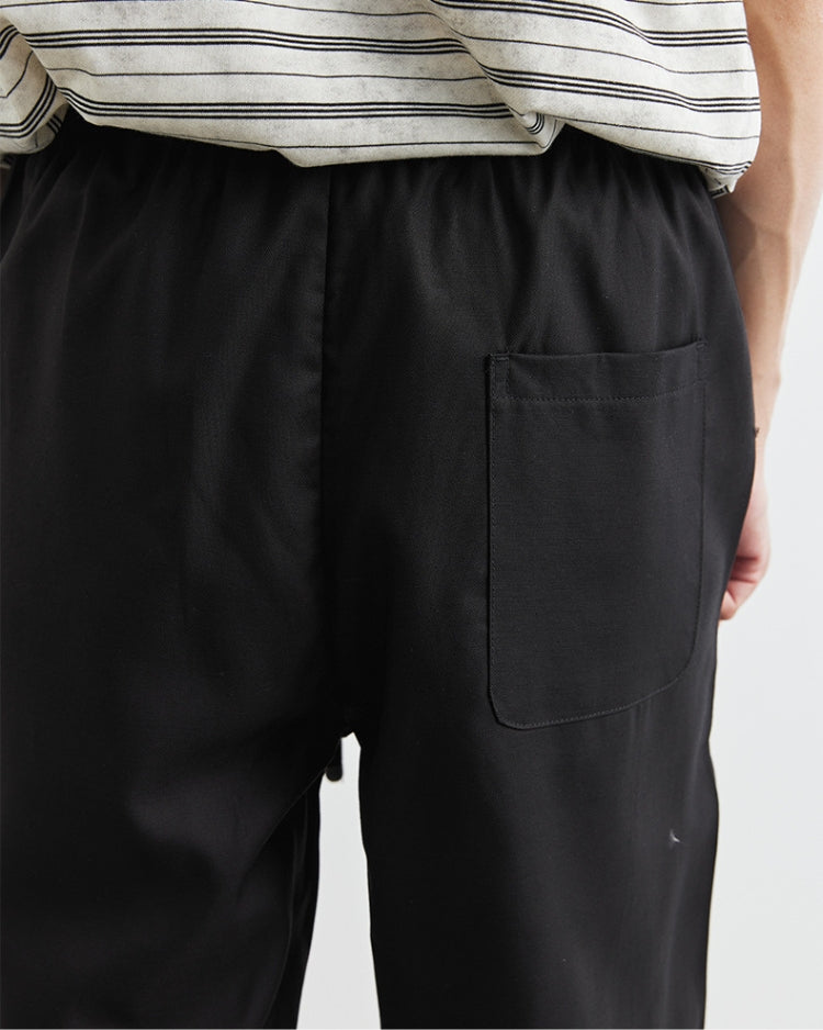 Pantaloni in lino a gamba larga con cintura in vita