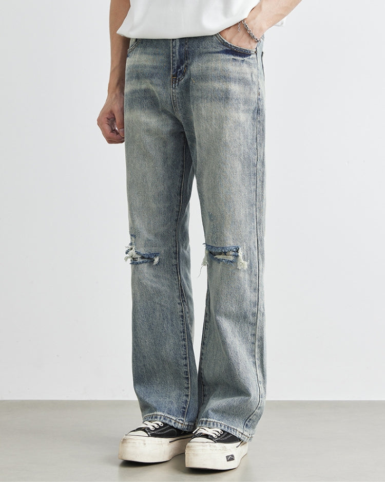 Jeans i denim med vide ben og slitasje