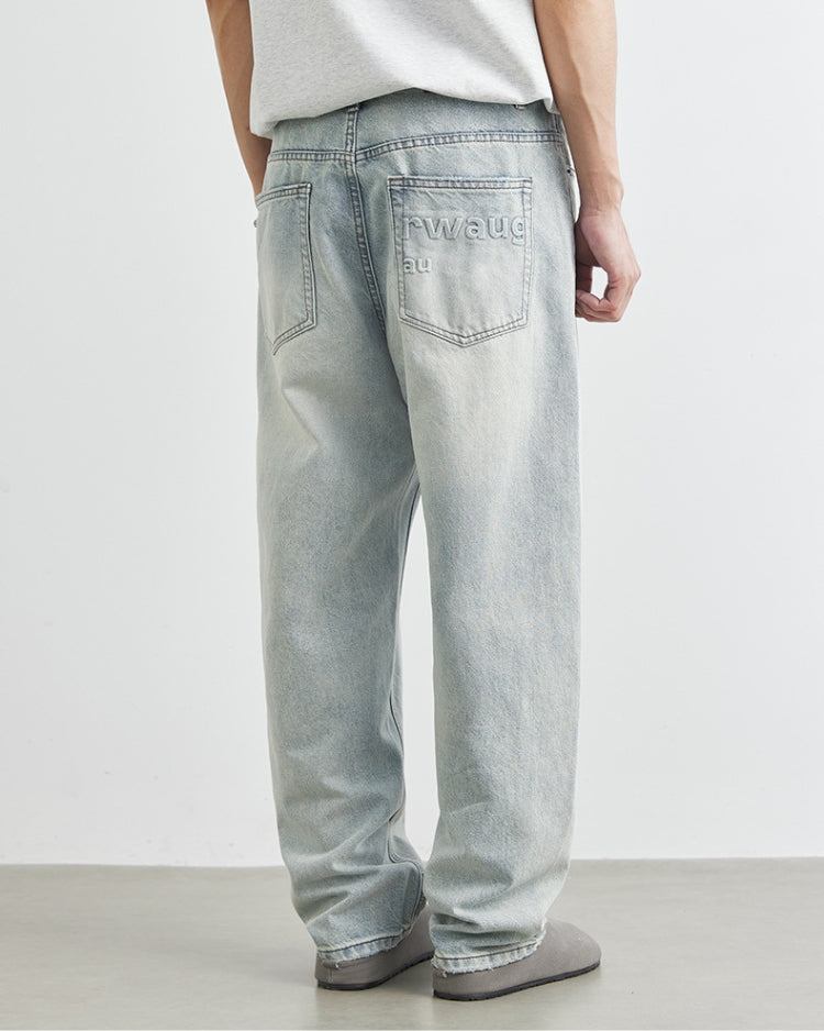 Calça jeans baggy com logotipo bordado em lavagem clara
