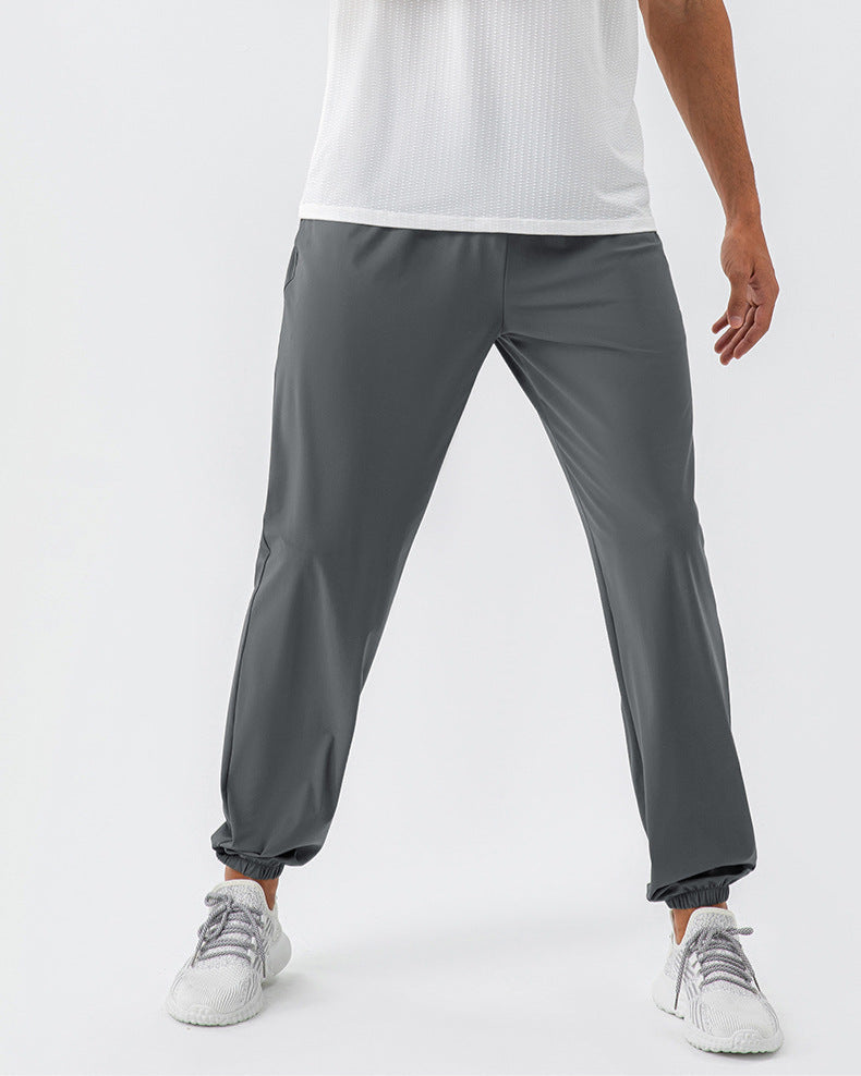 Calça esportiva elástica de nylon, solta e de secagem rápida