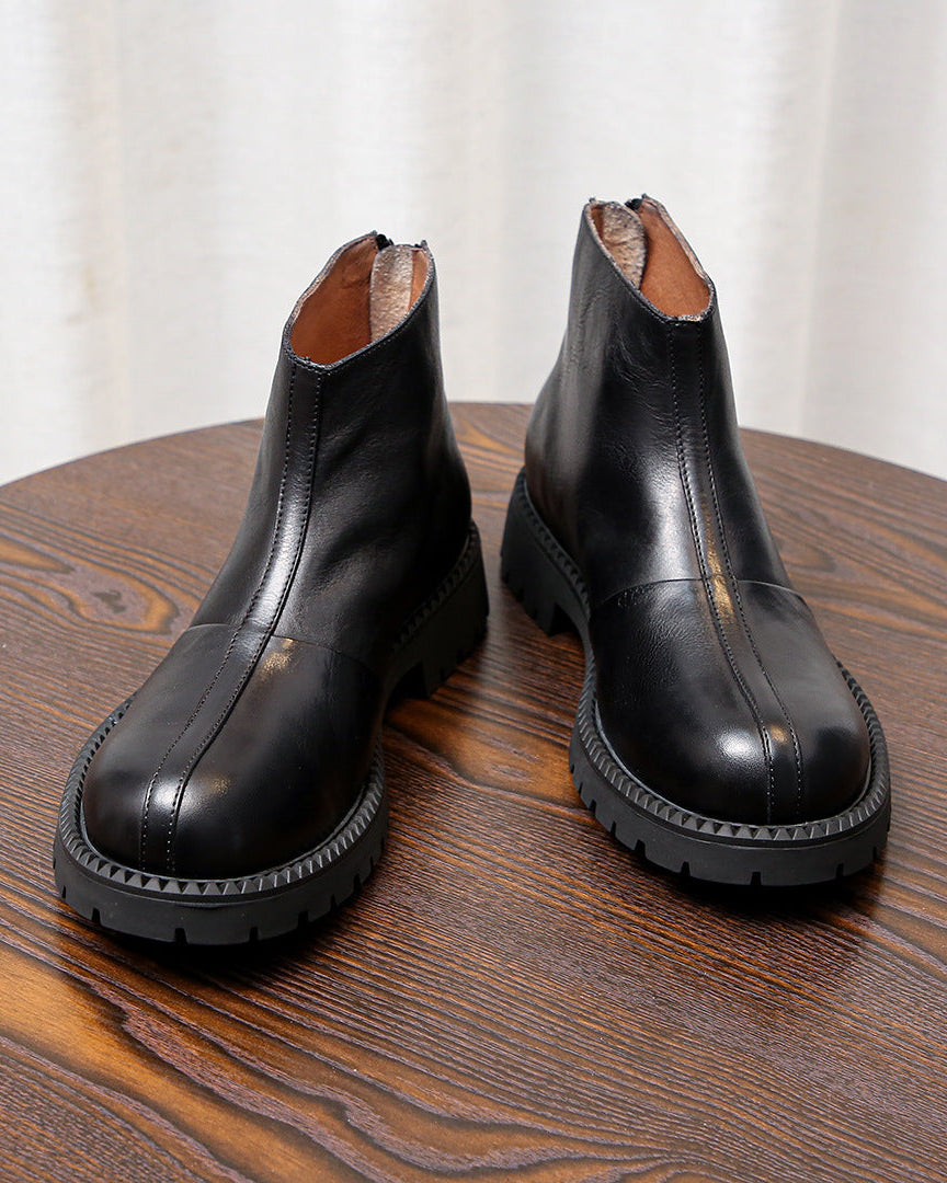 As botas de couro robustas com fecho de correr