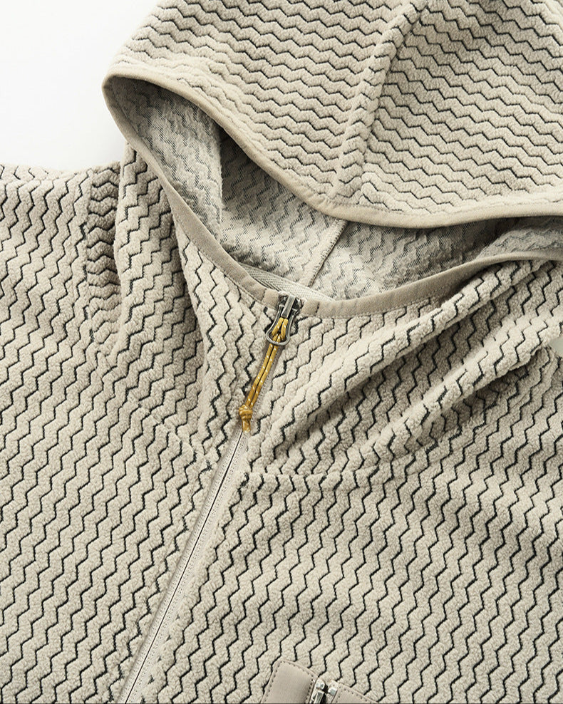 Die Jacke mit Kapuze und Waffelmuster