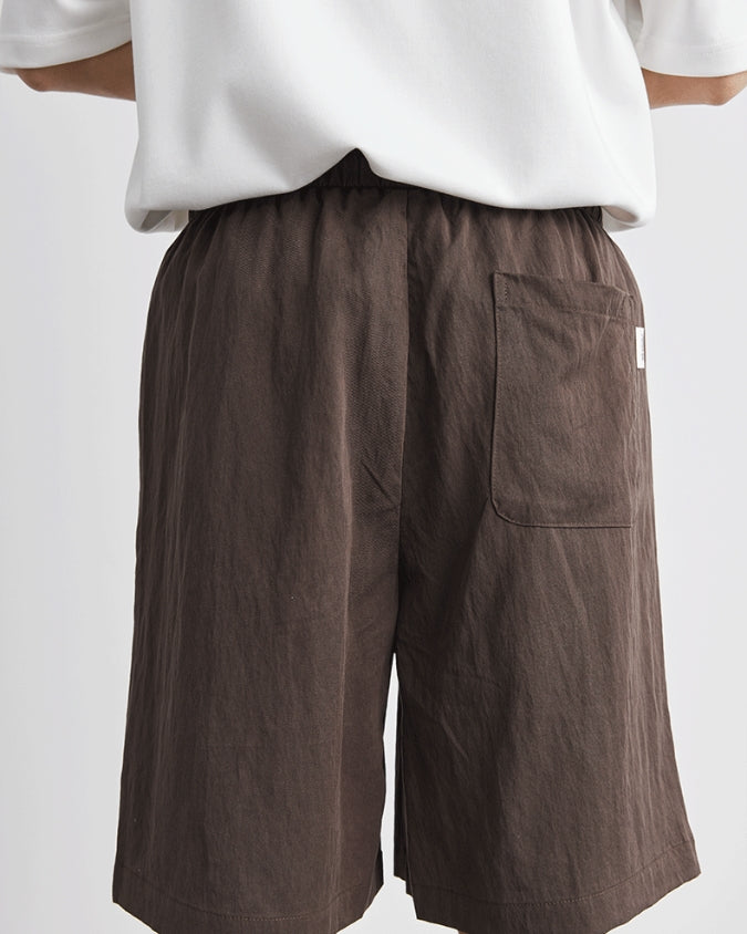 Pantalones cortos anchos relajados de lino con cordones