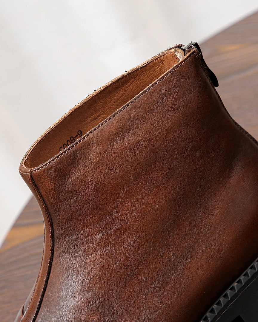 Las botas de piel con cremallera