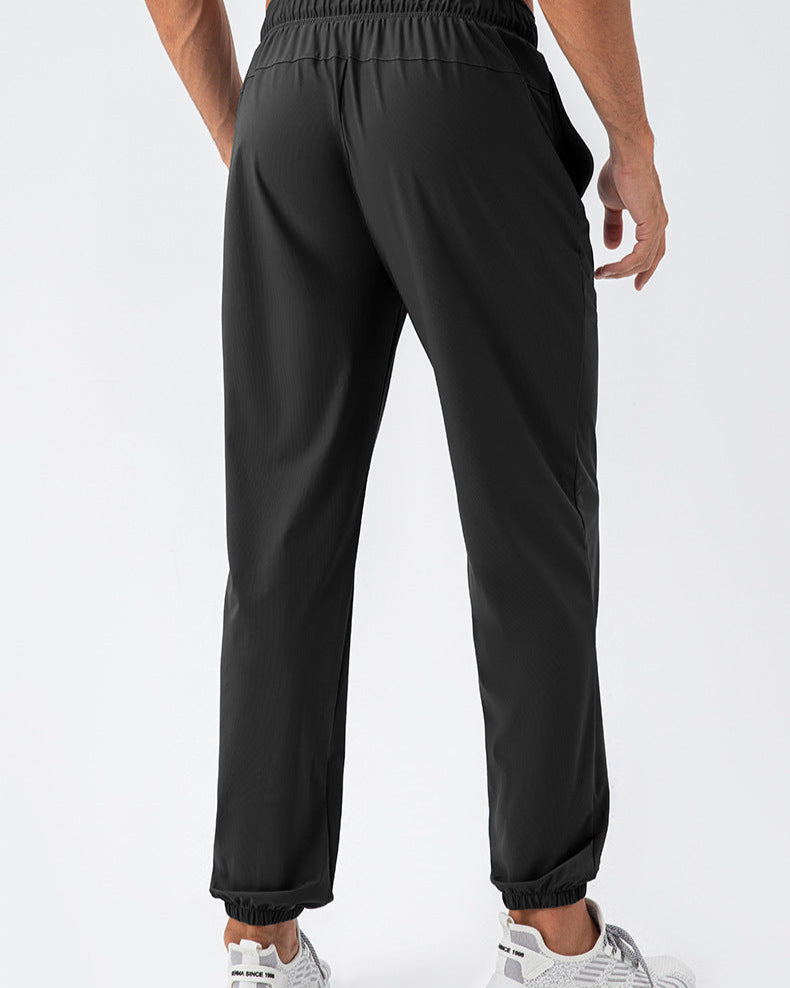 Pantalones deportivos elásticos de nylon Cool Loose de secado rápido