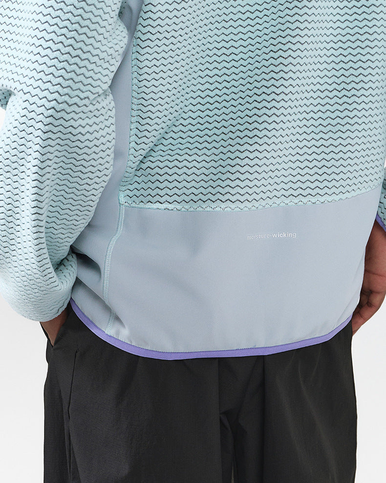 La veste zippée à motif gaufré