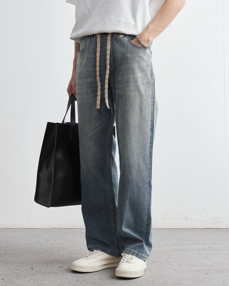 Jeans dritti con coulisse a grandi lacci sbiaditi