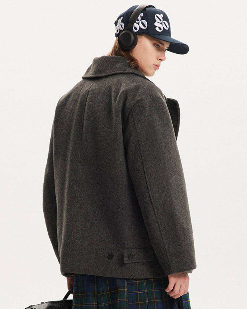 Giacca in lana con tasca asimmetrica