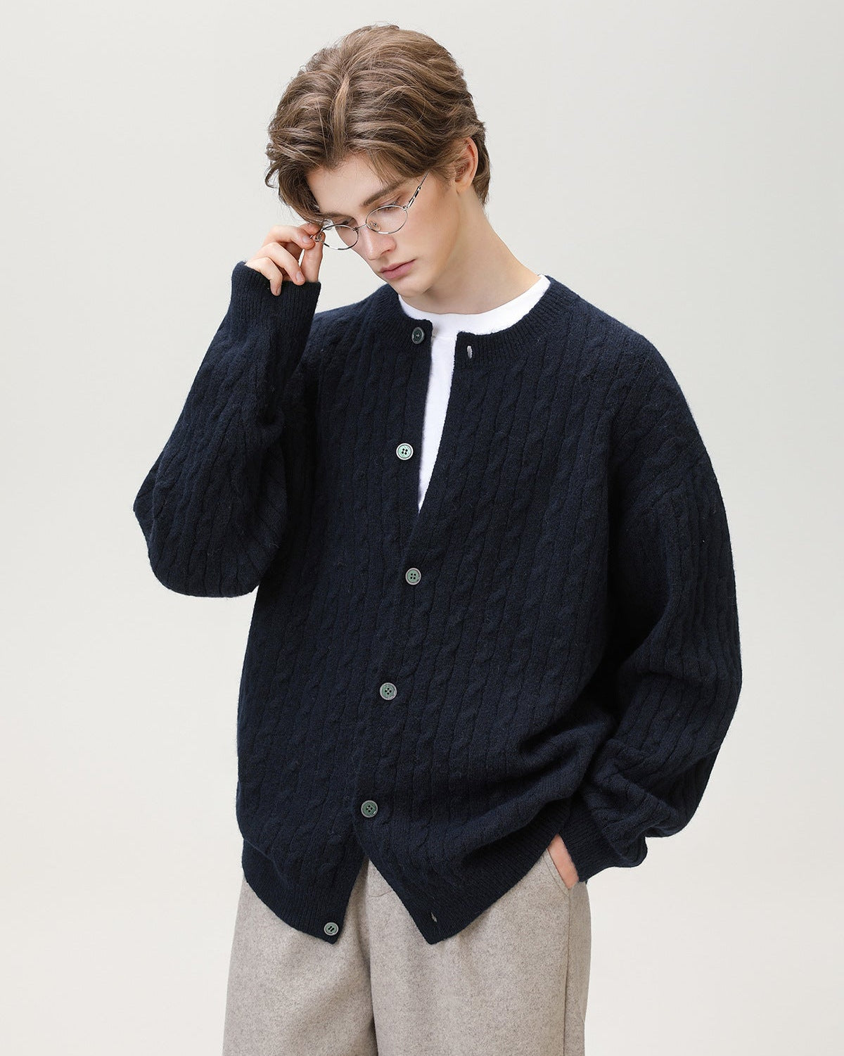 Cardigan con bottoni in maglia a cavo