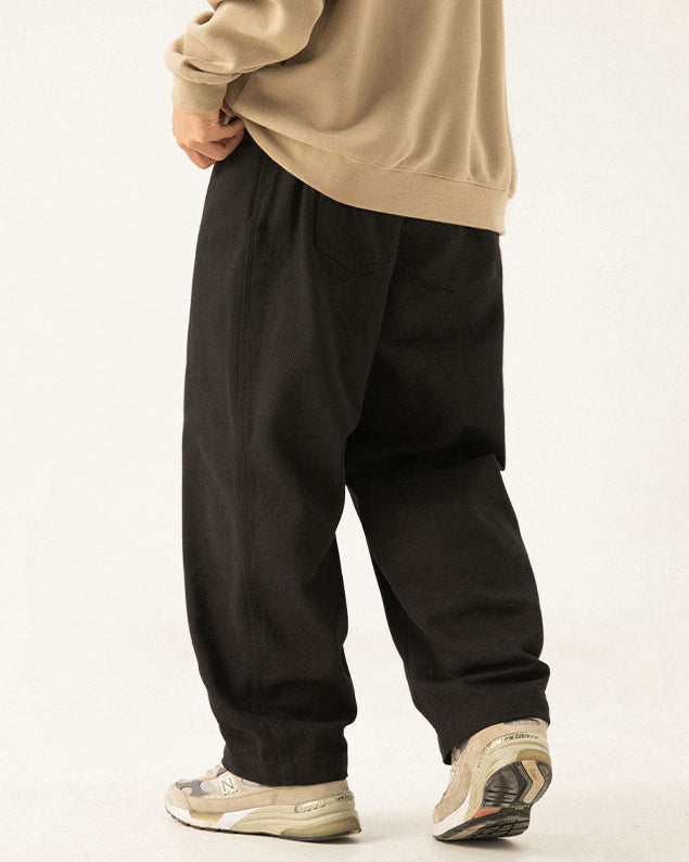 De gedrapeerde broek van Twill Ease