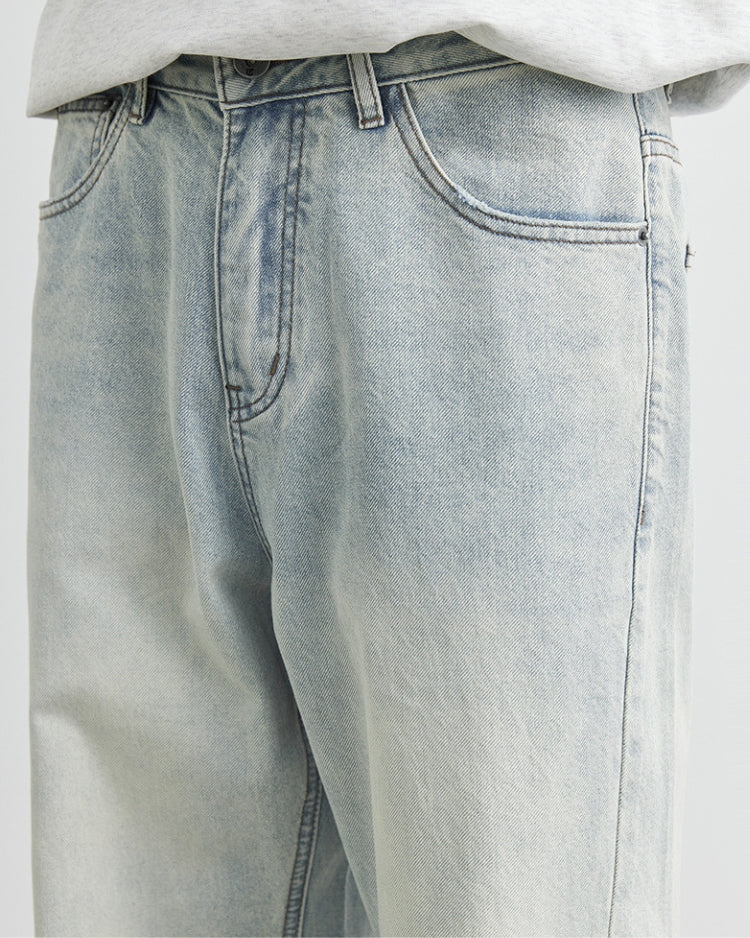Calça jeans baggy com logotipo bordado em lavagem clara