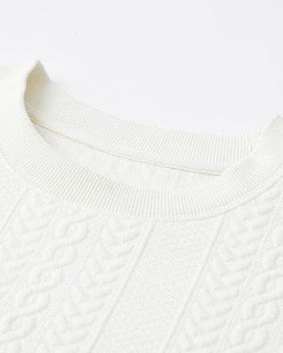 Kabelstickad tröja med texturerad väv