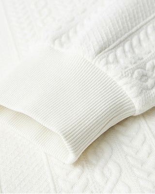 Kabelstickad tröja med texturerad väv