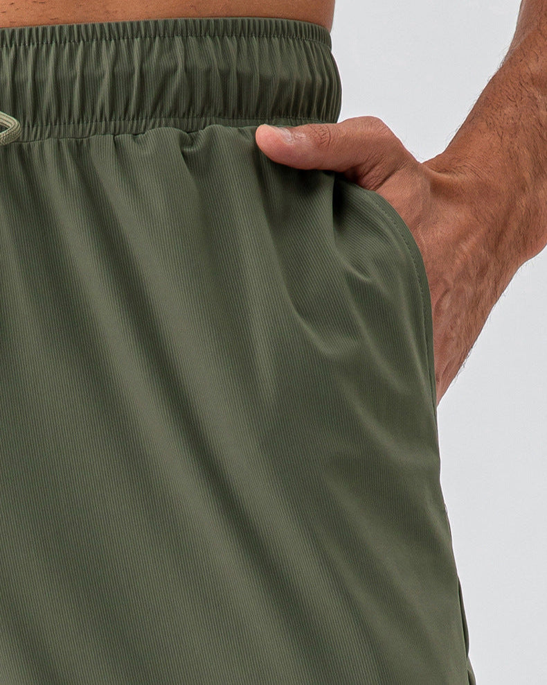 Quần thể thao co giãn nhanh khô bằng vải nylon thoáng mát